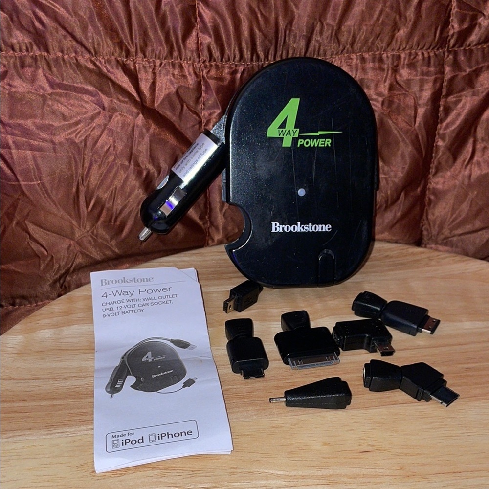 Brookstone Black & Green Multi-Adapter Charger with carrying bag.